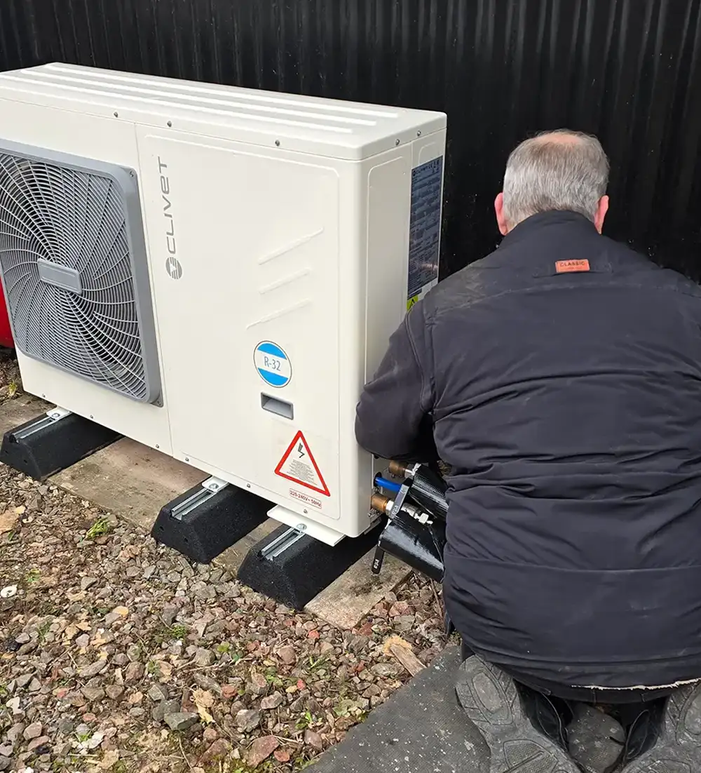 A air source heat pump being repaired by Blackdown Heating Ltd