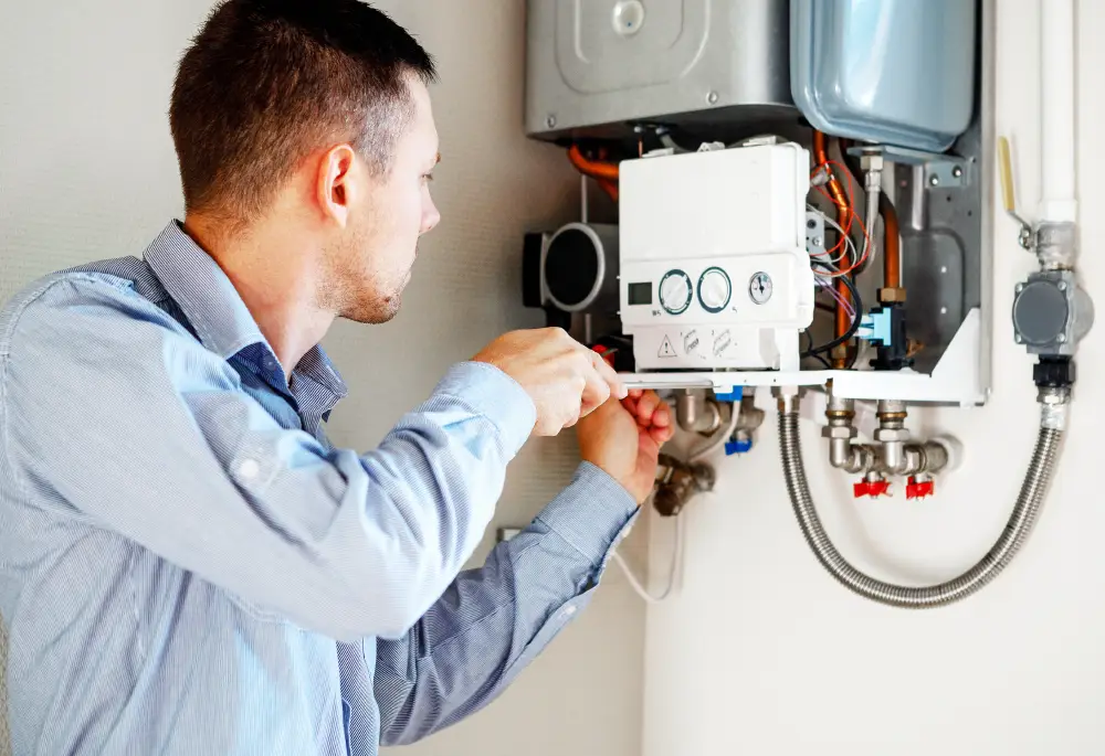 A heating engineer inspecting a gas boiler