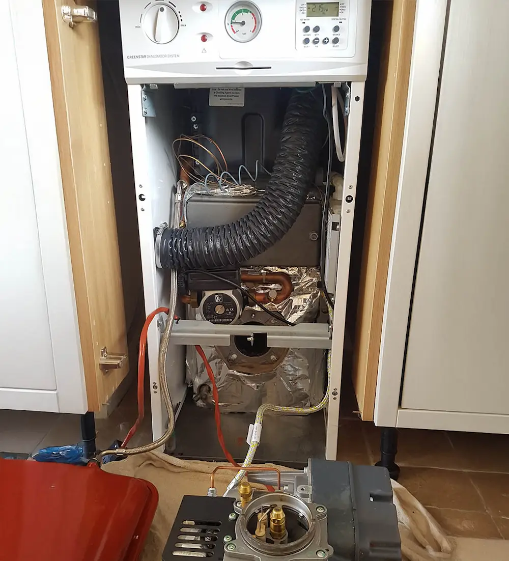 A boiler being repaired by Blackdown Heating Ltd