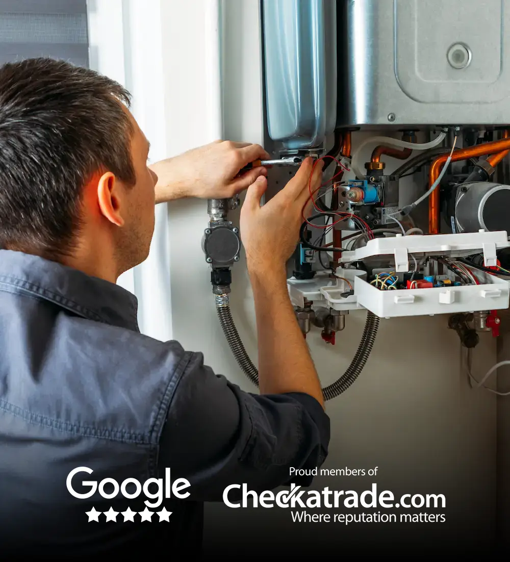 A Blackdown Heating Ltd engineer working on a boiler
